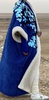blue sequins and white bisht